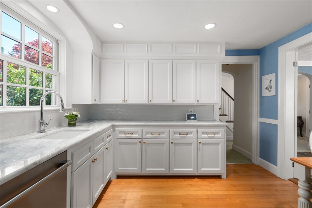 15 Lafayette Circle Wellesley, MA 02482 - Photo 11 of 23 a kitchen with a sink stove and cabinets
