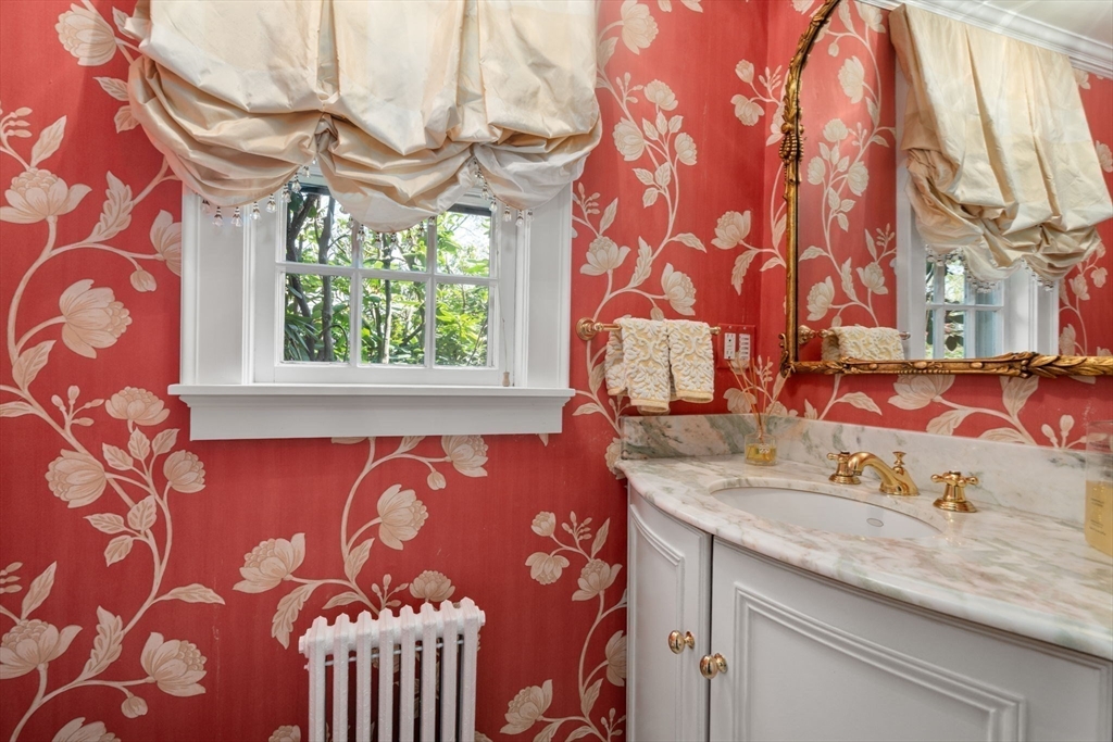 15 Lafayette Circle Wellesley, MA 02482 - Photo 15 of 23 a bathroom with a sink and a mirror