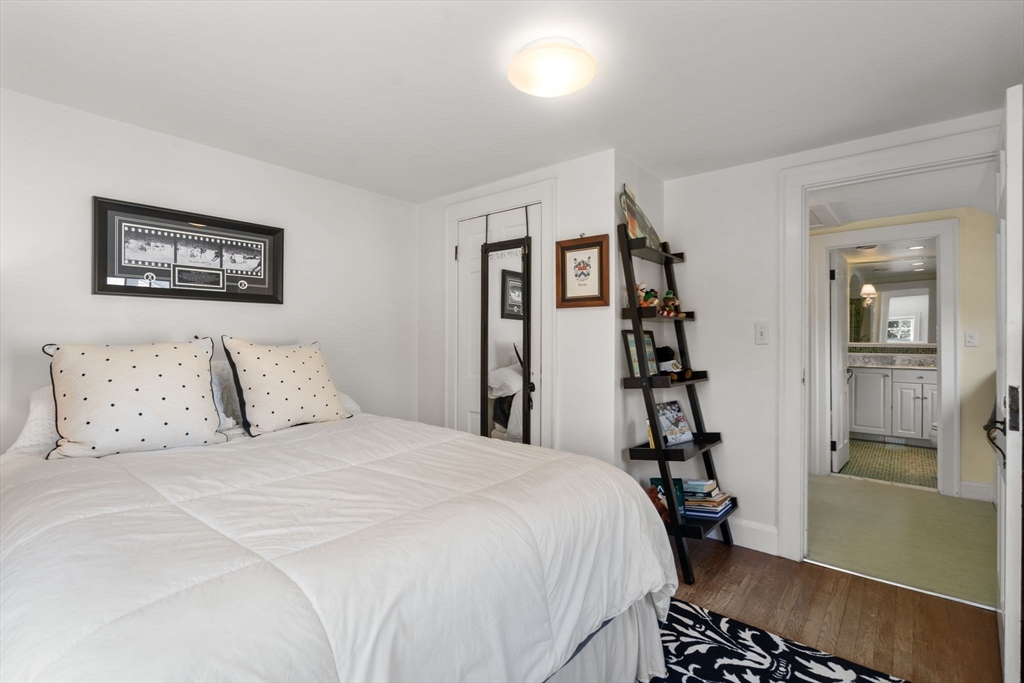15 Lafayette Circle Wellesley, MA 02482 - Photo 18 of 23 a bedroom with a bed and a walk in closet