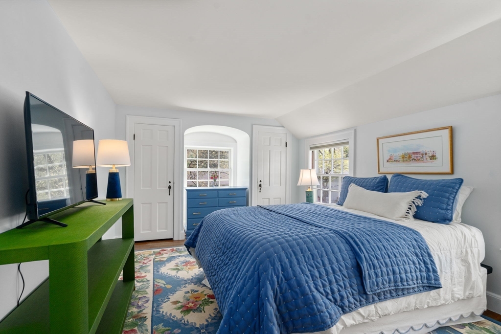 15 Lafayette Circle Wellesley, MA 02482 - Photo 20 of 23 a bedroom with a bed window and a television