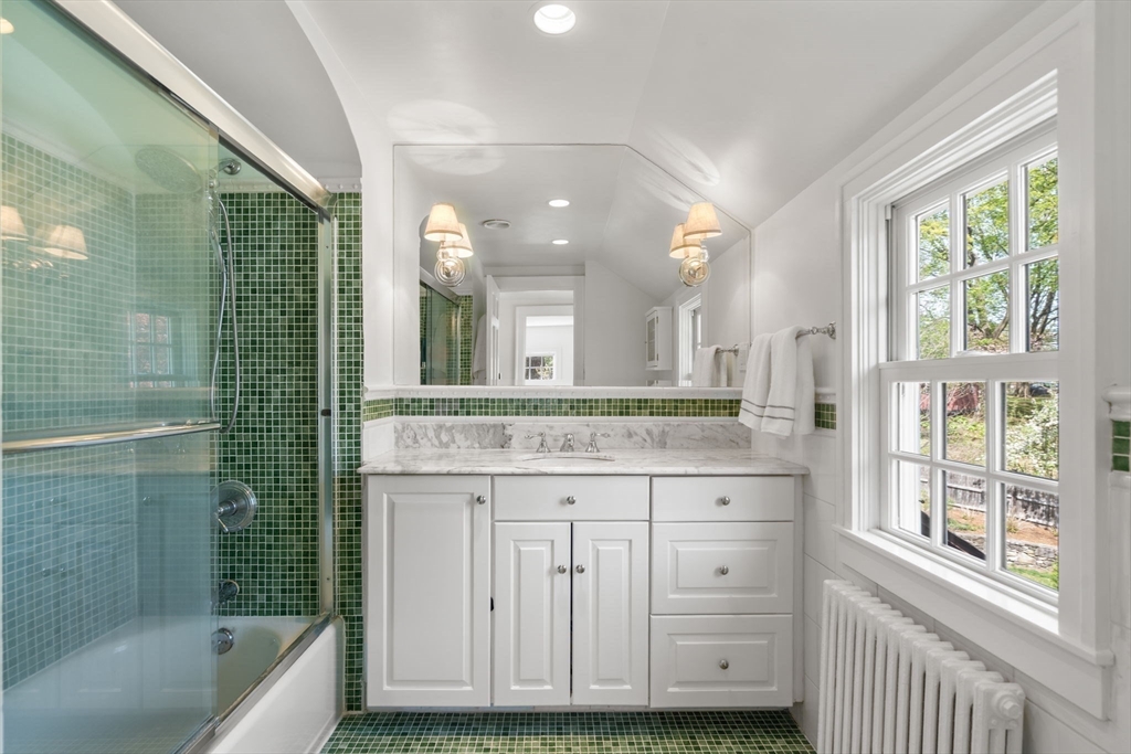 15 Lafayette Circle Wellesley, MA 02482 - Photo 22 of 23 a bathroom with a granite countertop sink a large mirror and a bathtub