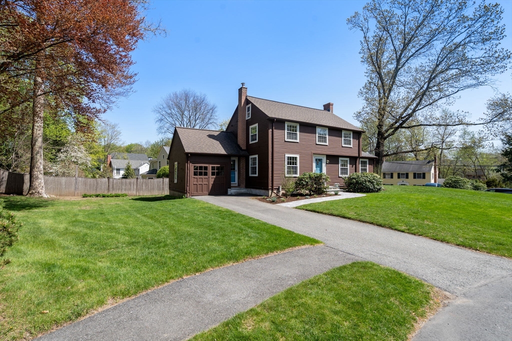 15 Lafayette Circle Wellesley, MA 02482 - Photo 23 of 23 a front view of a house with a yard and trees