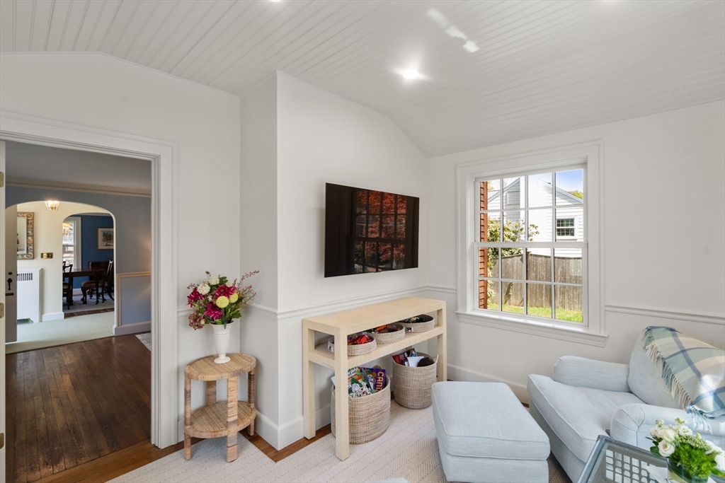 15 Lafayette Circle Wellesley, MA 02482 - Photo 8 of 23 a living room with furniture a flat screen tv and a window