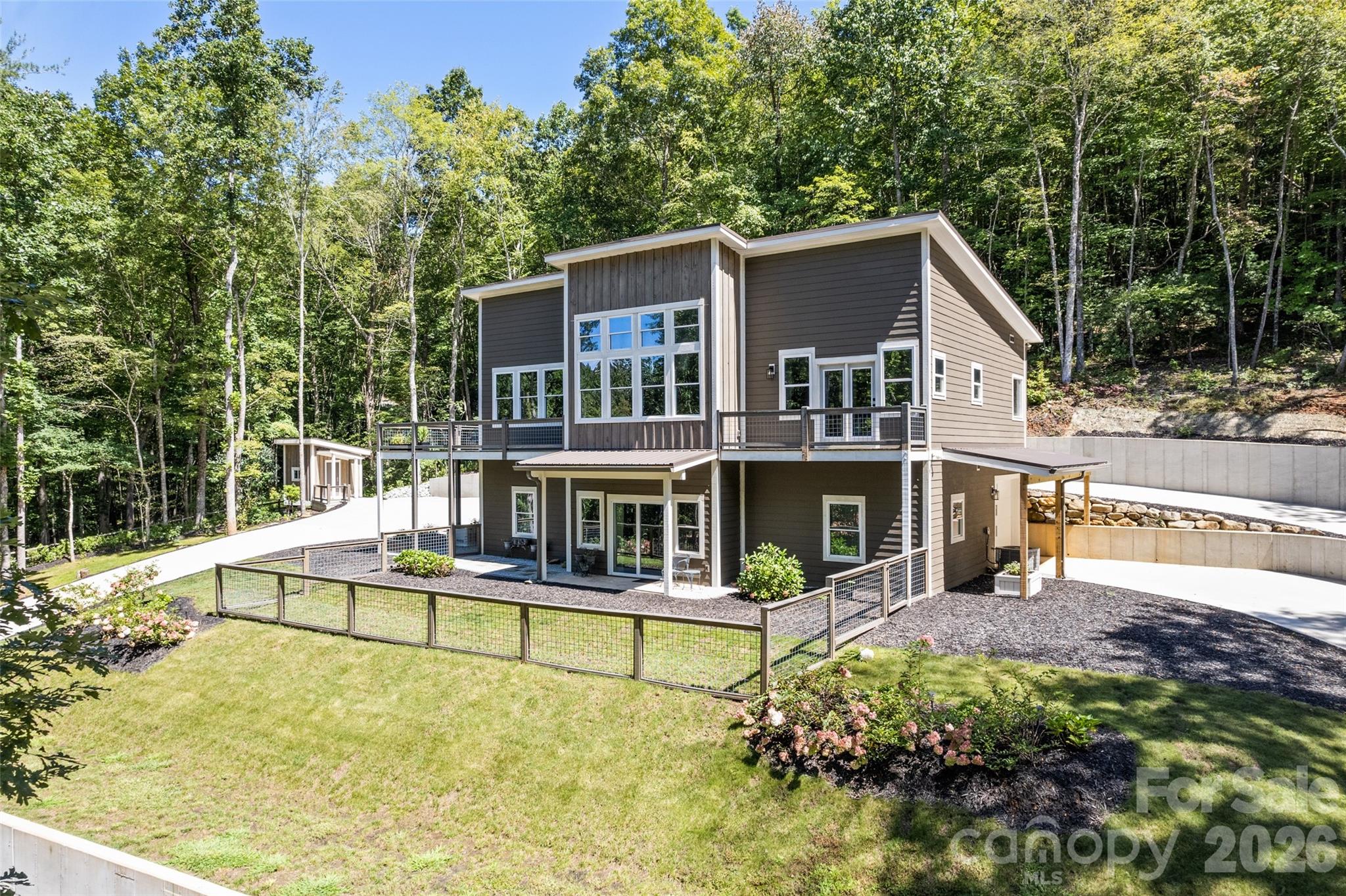 1185 Wallalieu Road Otto, NC 28763 - Photo 39 of 43 front view of a house with a small yard