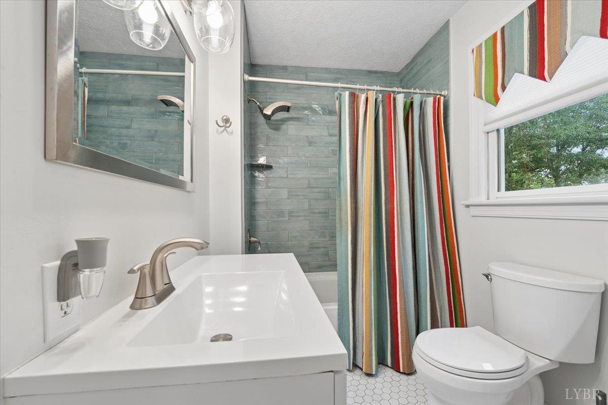 3289 Peaks Road Bedford, VA 24523 - Photo 58 of 71 a bathroom with a sink and a mirror
