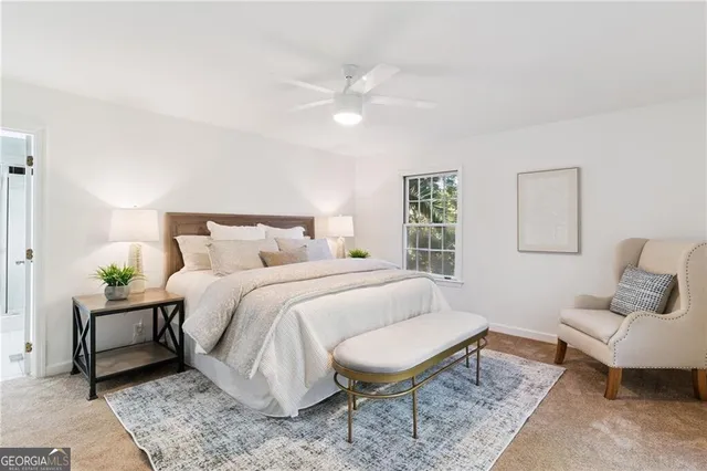 a bedroom with a bed and a couch