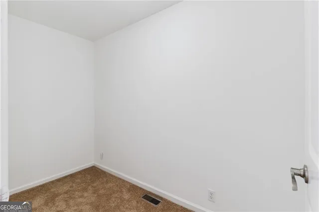 a kitchen with a sink and a refrigerator