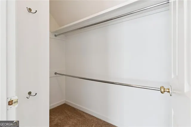 a bathroom with a bathtub shower sink and mirror