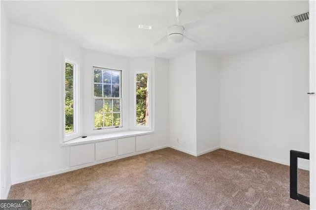 a utility room with cabinets and washer dryer