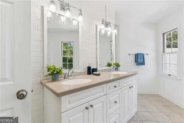 a view of a patio with couches table and chairs and potted plants