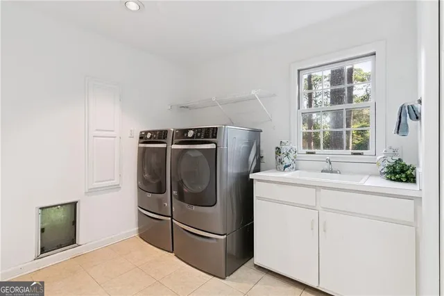 a dining room with wooden floor a chandelier fan and windows