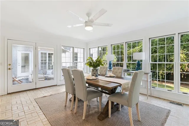 a view of a dining room with furniture window and outside view