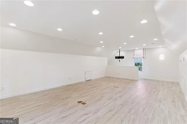 a front view of a house with a garden and pathway