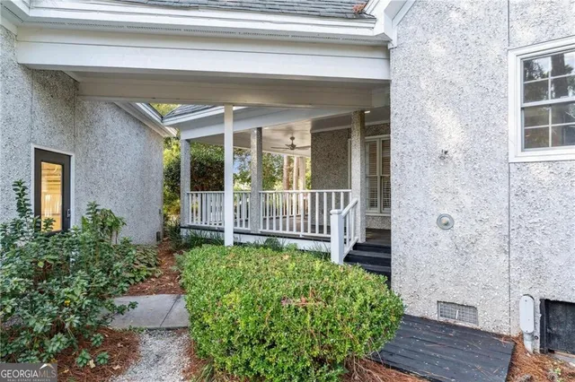 an aerial view of a houses with a yard