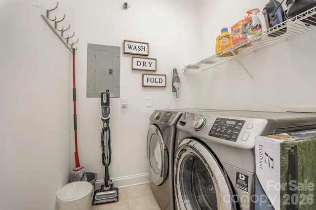 a bedroom with a bed couch and window