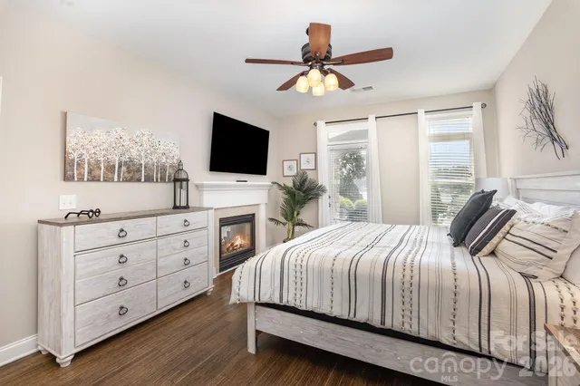 a bathroom with a granite countertop toilet sink and mirror