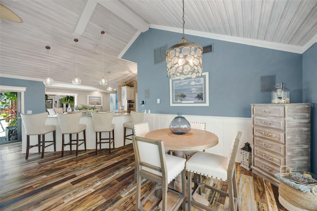 6605 Seabird Way Apollo Beach, FL 33572 - Photo 18 of 52 a view of a dining room with furniture and chandelier