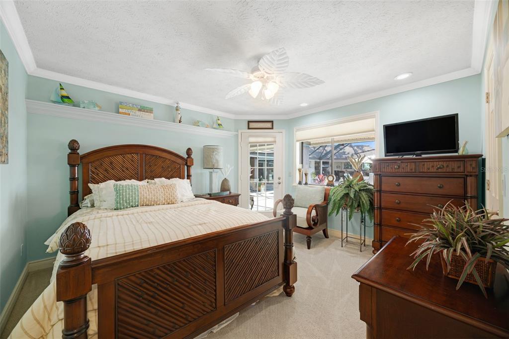 6605 Seabird Way Apollo Beach, FL 33572 - Photo 26 of 52 a bedroom with a bed and a flat tv screen on dresser