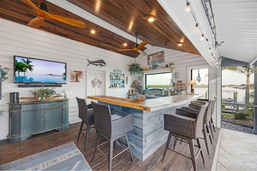 6605 Seabird Way Apollo Beach, FL 33572 - Photo 30 of 52 a dining room with furniture and wooden floor