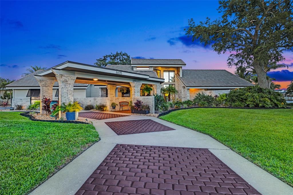 6605 Seabird Way Apollo Beach, FL 33572 - Photo 3 of 52 a front view of a house with a yard