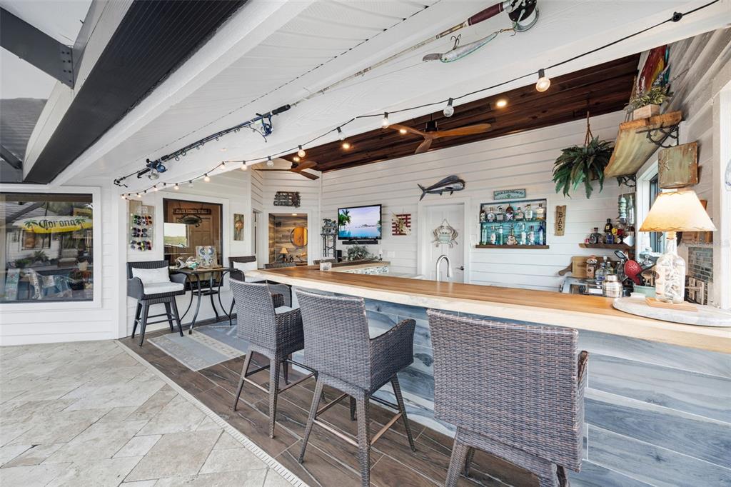 6605 Seabird Way Apollo Beach, FL 33572 - Photo 31 of 52 a dining hall with stainless steel appliances granite countertop a stove and cabinets with wooden floor