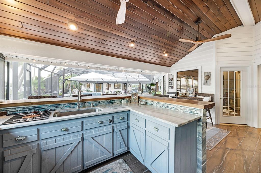 6605 Seabird Way Apollo Beach, FL 33572 - Photo 33 of 52 a kitchen with a sink and cabinets