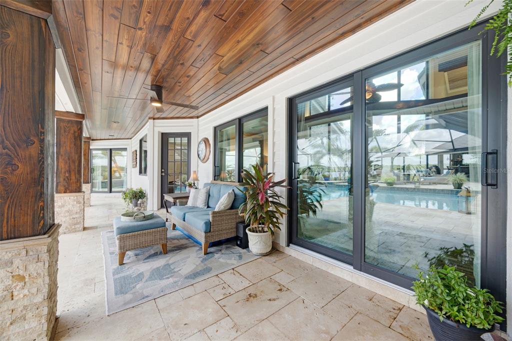 6605 Seabird Way Apollo Beach, FL 33572 - Photo 43 of 52 a outdoor space with patio couch and glass door