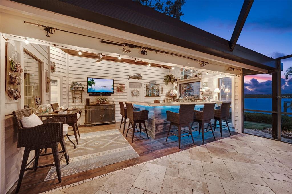 6605 Seabird Way Apollo Beach, FL 33572 - Photo 7 of 52 a dining hall with couches a dining table and chairs with wooden floor