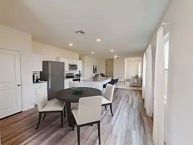 a living room with furniture and a table