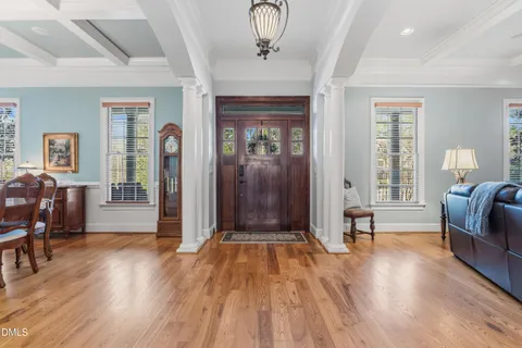 a view of a livingroom with furniture and hardwood floor