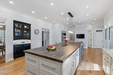 a kitchen with stainless steel appliances granite countertop a sink and a refrigerator