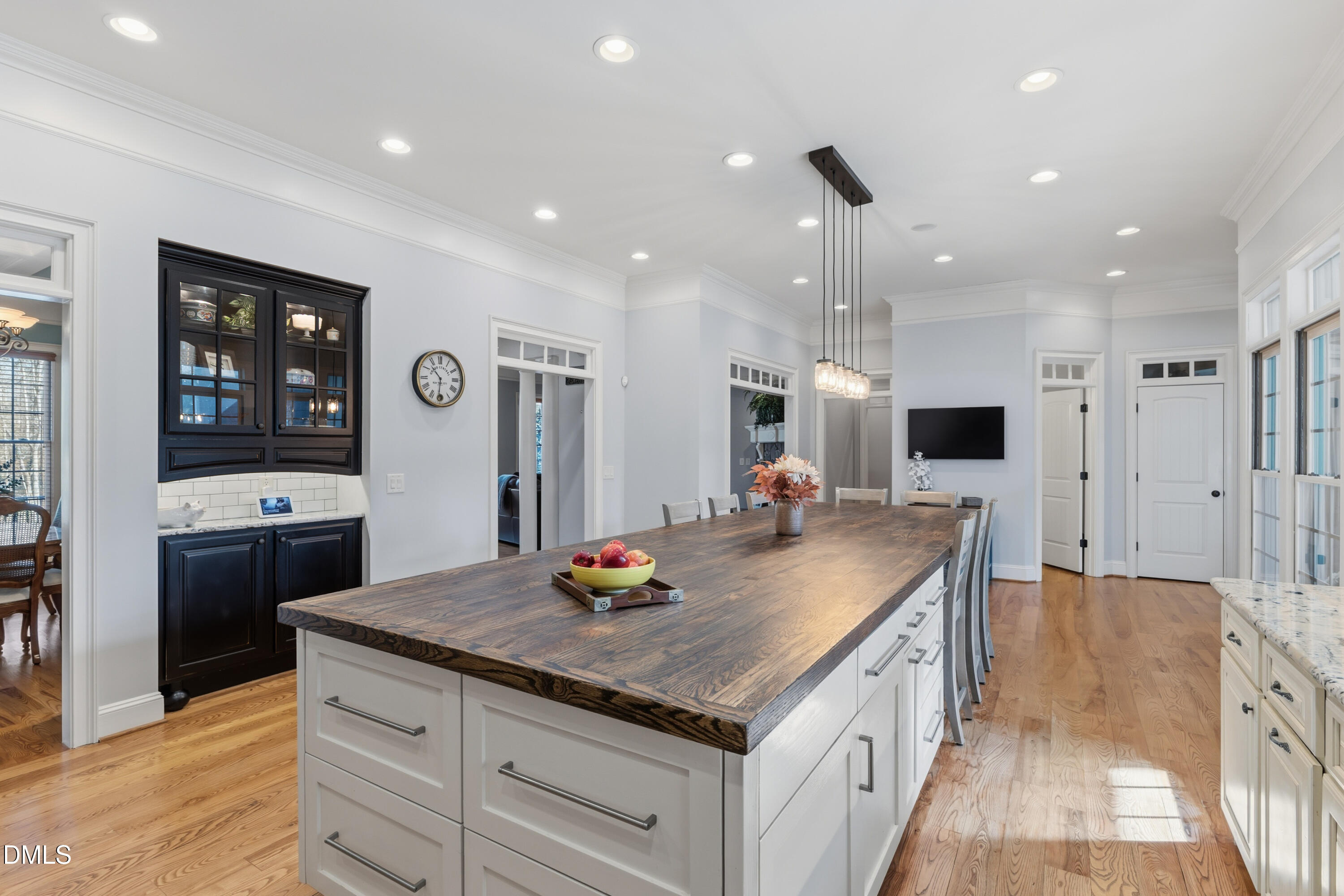 1709 Colombard Court Wake Forest, NC 27587 - Photo 18 of 49 a kitchen with stainless steel appliances granite countertop a sink and a refrigerator