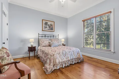 a bedroom with bed and a window