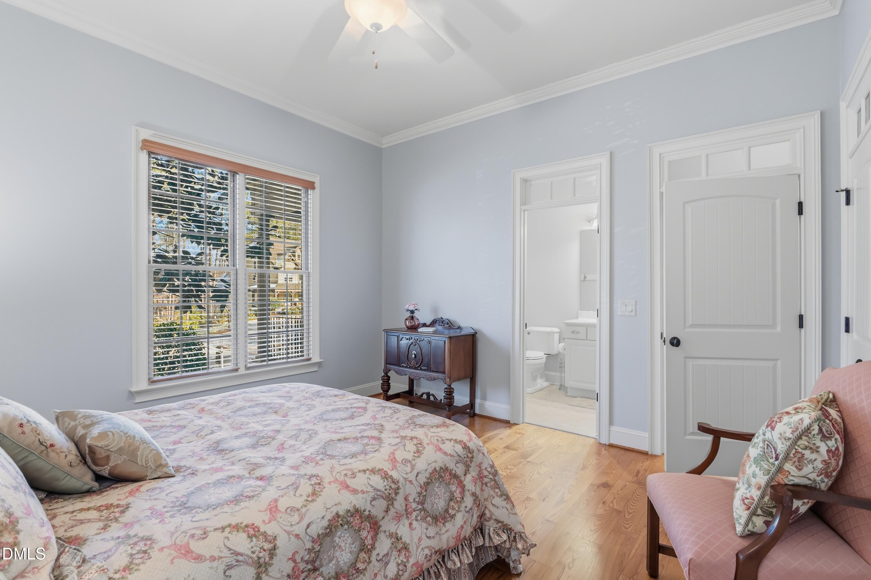 1709 Colombard Court Wake Forest, NC 27587 - Photo 26 of 49 a bedroom with a bed and a window