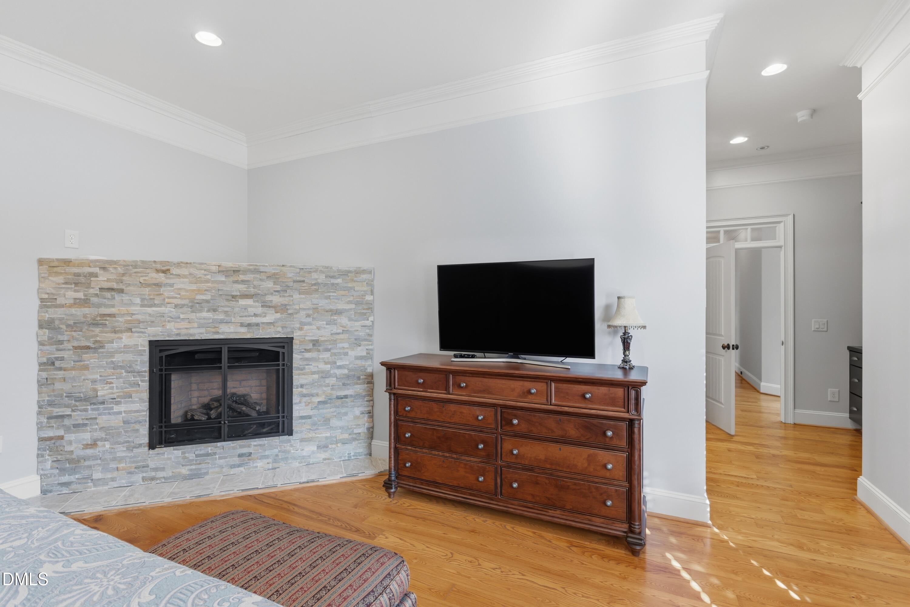 1709 Colombard Court Wake Forest, NC 27587 - Photo 31 of 49 a living room with furniture and a flat screen tv