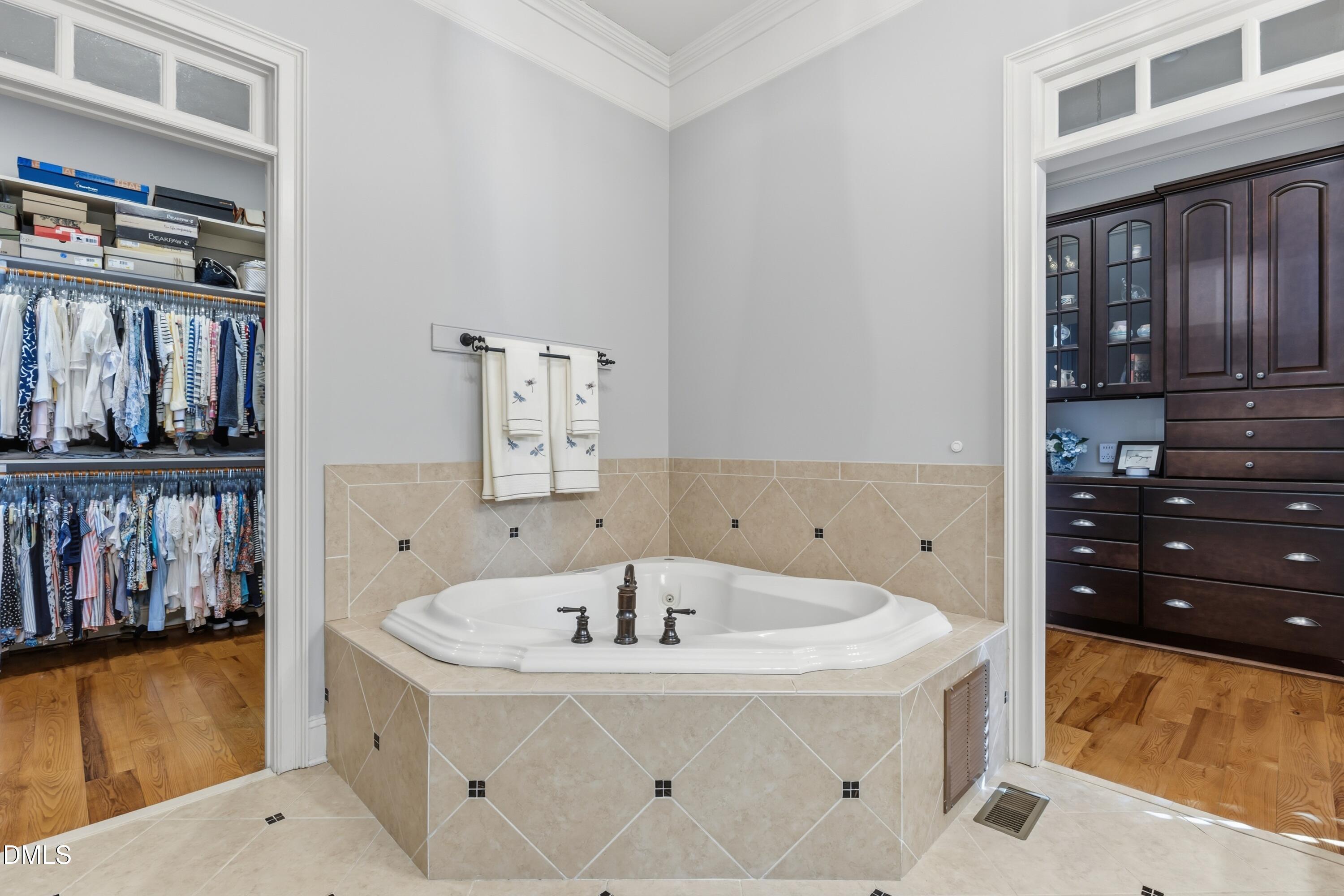 1709 Colombard Court Wake Forest, NC 27587 - Photo 33 of 49 a white bath tub sitting in a bathroom