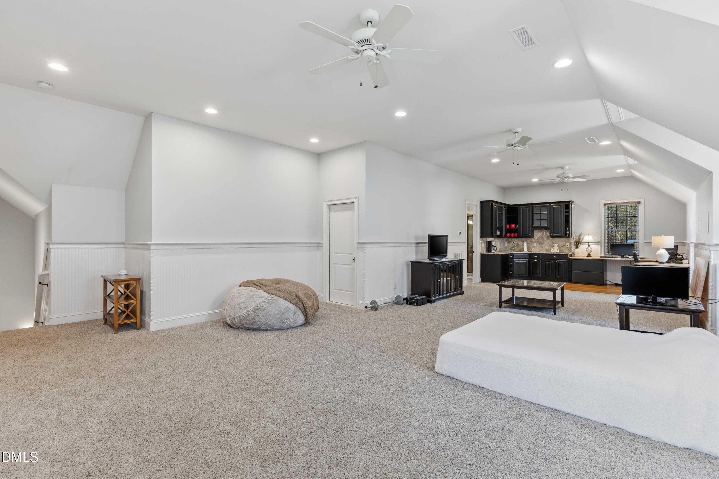 1709 Colombard Court Wake Forest, NC 27587 - Photo 35 of 49 a living room with furniture and kitchen view