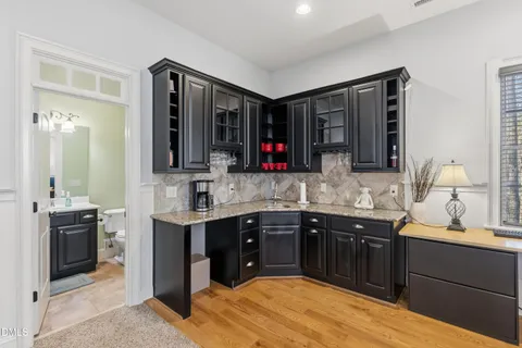 a kitchen with a sink and cabinets
