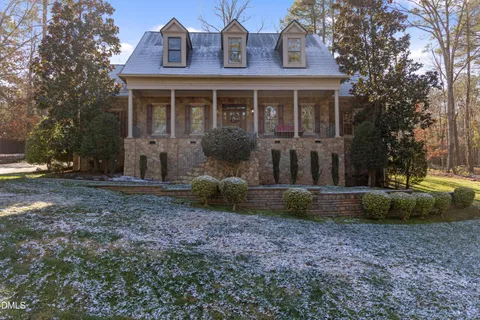a view of a brick house with a yard