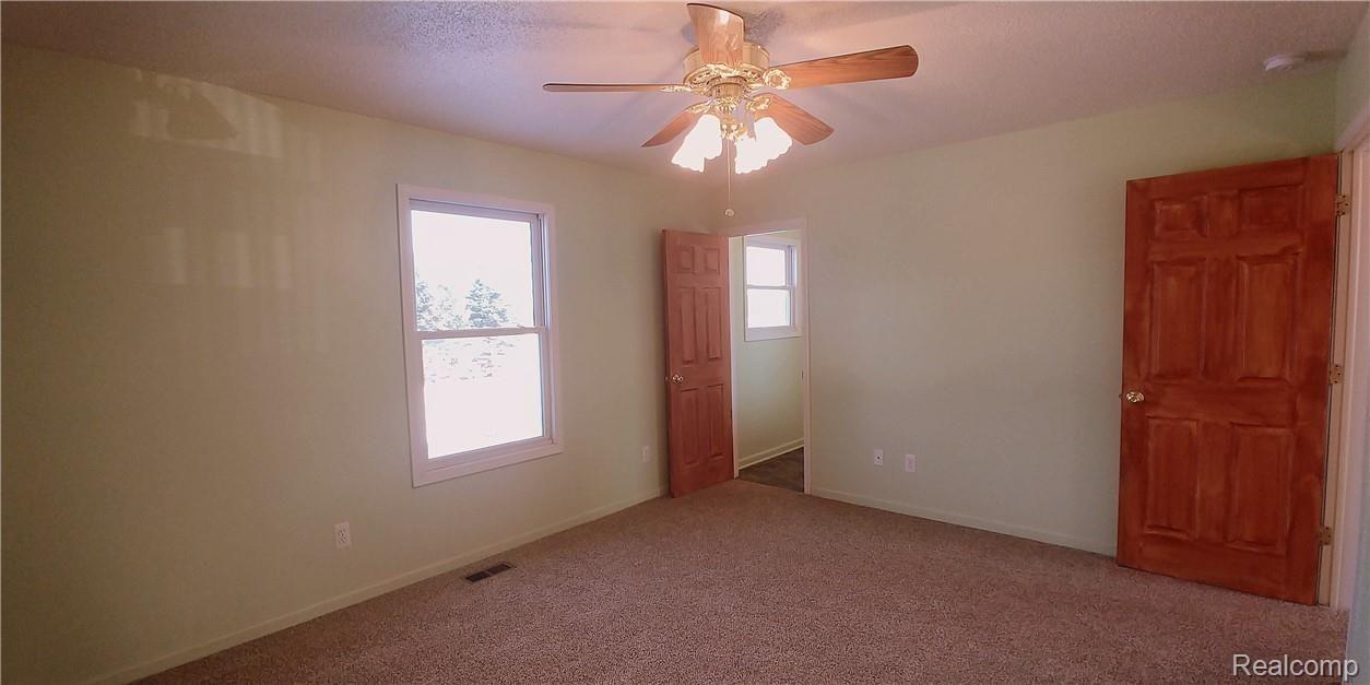 886 Chase Lake Road Howell, MI 48855 - Photo 19 of 52 7a. Master Bedroom with private bath