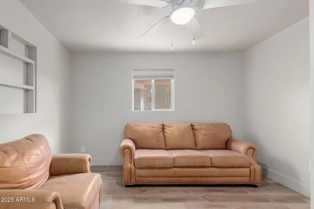 a living room with furniture a window and a couch