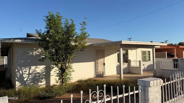 a view of a brick house with a large windows