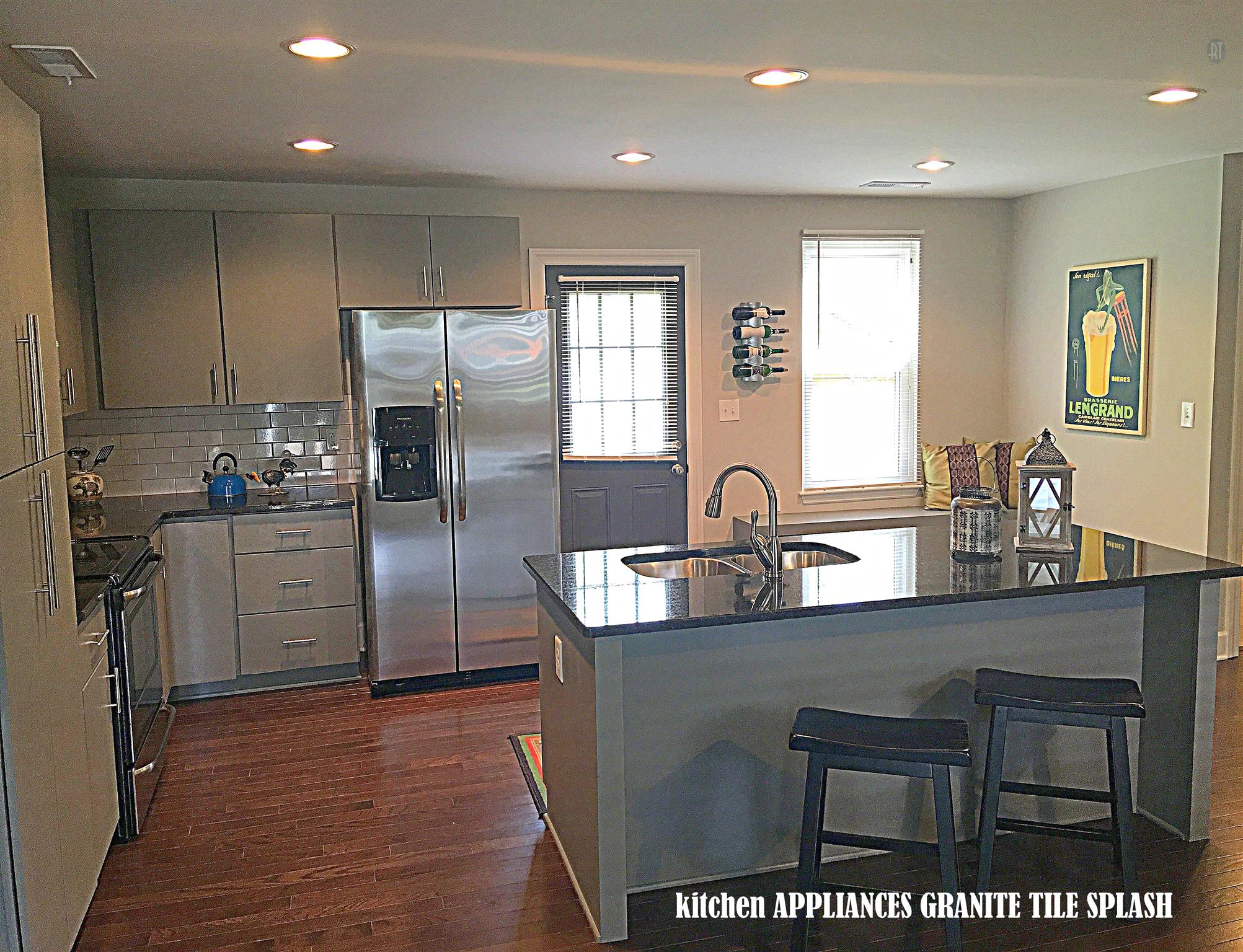 213 Warrior Road Madison, TN 37115 - Photo 4 of 11 This kitchen features a stacked pantry cabinet, stainless appliance package, deep stainless sink and pull down faucet.