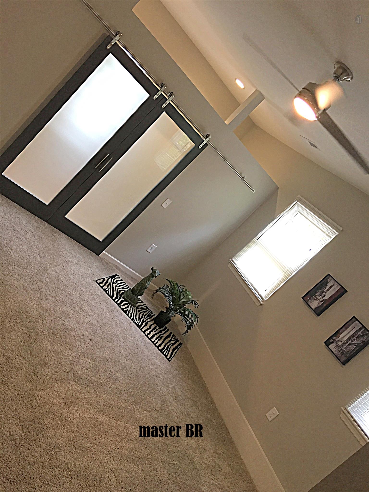 213 Warrior Road Madison, TN 37115 - Photo 7 of 11 Master suite: new carpet and ceiling fan with remote, double sliding doors to huge walk in closet with transoms and recessed lighting.