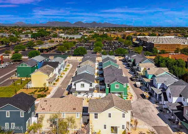 an aerial view of residential building with parking