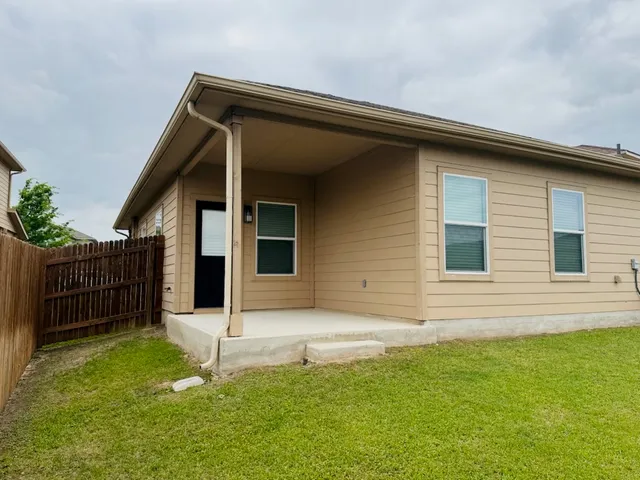 a backyard of a house with garden
