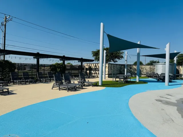 a view of a swimming pool with a patio