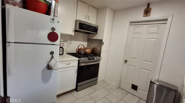 a kitchen with a stove and a microwave