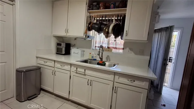a kitchen with a sink and cabinets