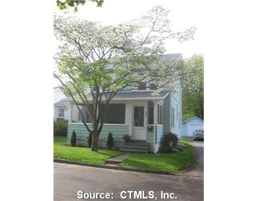 28 Springdale Street Milford, CT 06460 - Photo 1 of 1 a front view of a house with garden